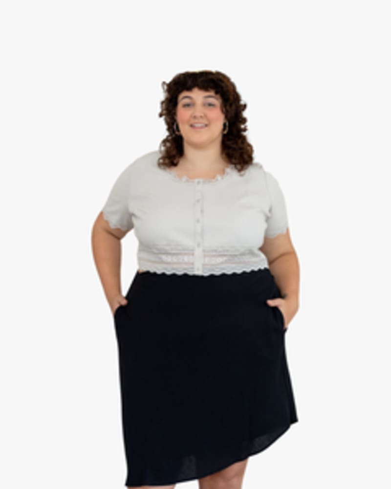 Front of a model wearing a size L Emily Tie-Waist Skirt in BLACK by Lovefool. | dia_product_style_image_id:249743